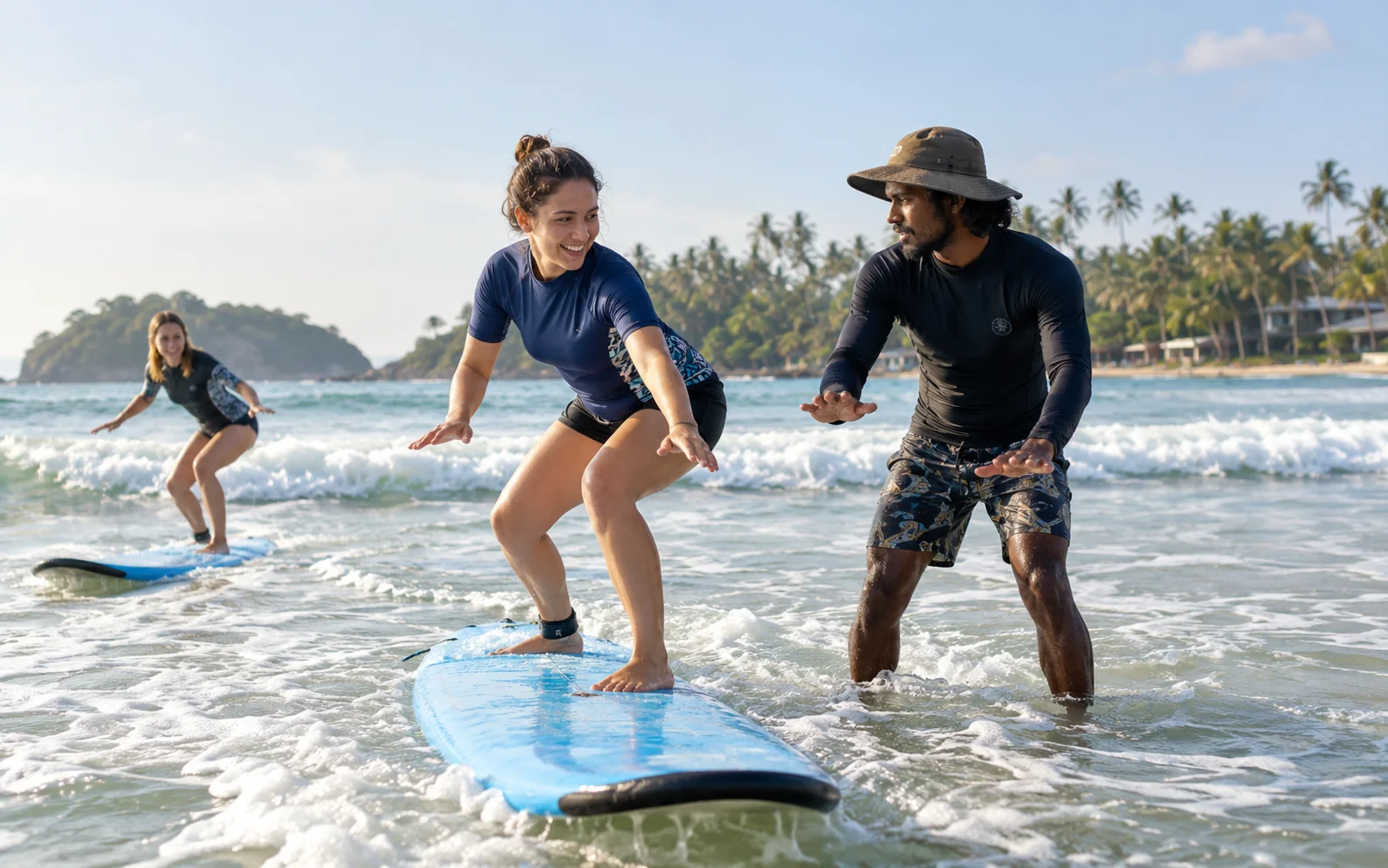 Beginner surfer practising with a local instructor in the gentle waves of Weligama Bay, Sri Lanka